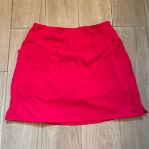 Bright pink santiny golf/tennis skort